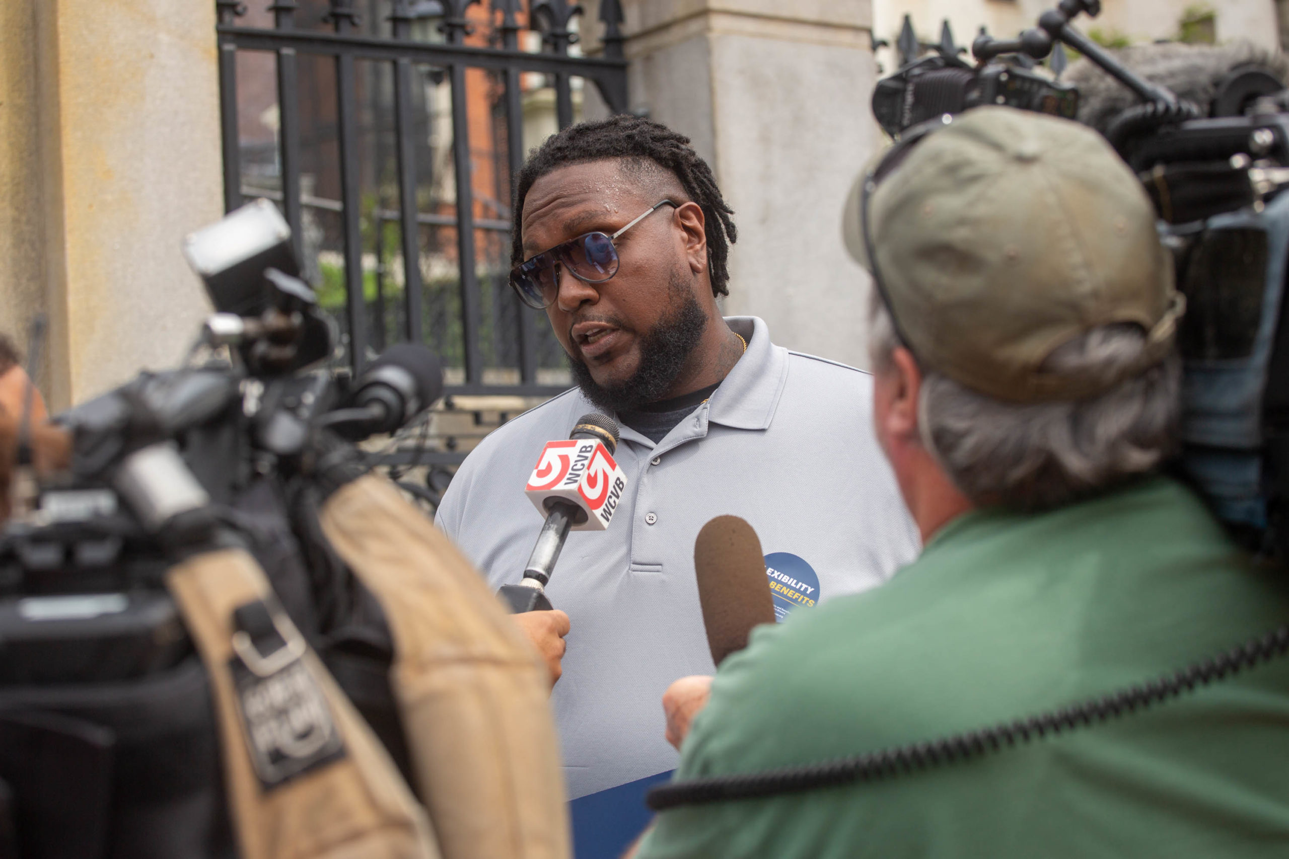 Marcus Cole, driver, speaks with local Boston media.